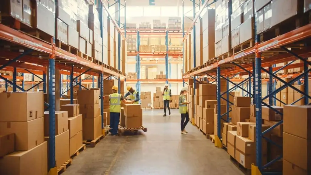 warehouse employees utilizing AI and ML for supply chain optimization